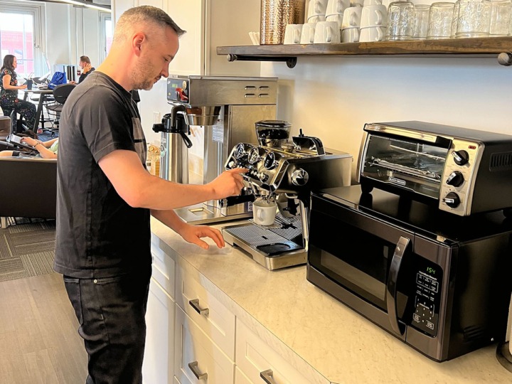 A member using the espresso machine in our community kitchen