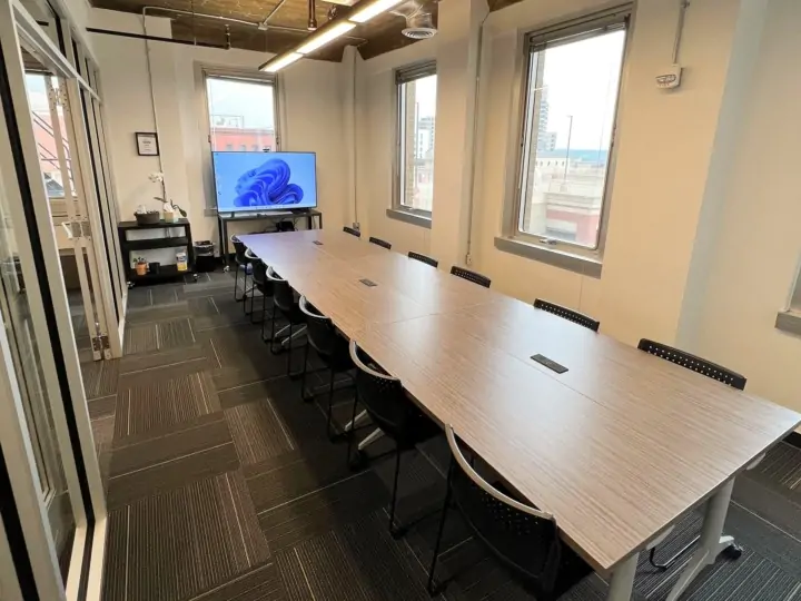 A large sectioned tables in the Learning Center conference room