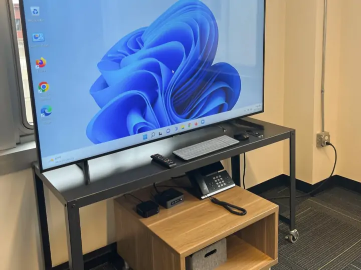 Large television with devices in the Learning Center conference room
